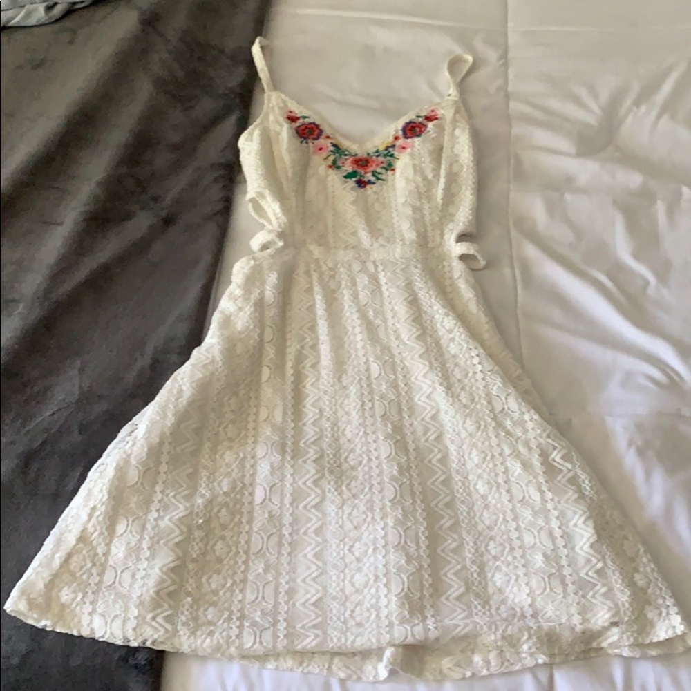 white lace dress with cutouts on sides